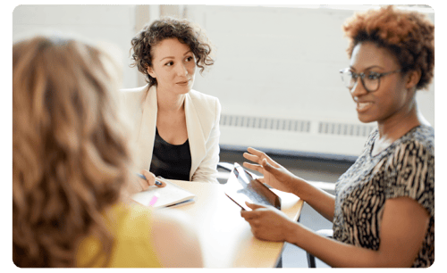 Three female colleagues in a discussion