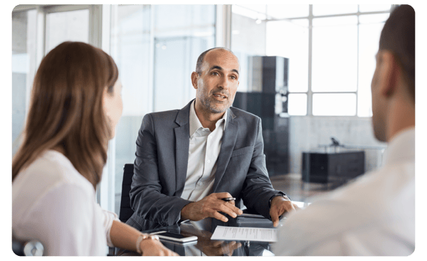 Male banker in a discussion with customers Male banker in a discussion with customers